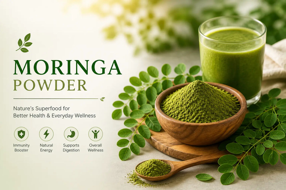 Moringa powder in a wooden bowl with fresh moringa leaves and a green smoothie, showing natural superfood nutrition